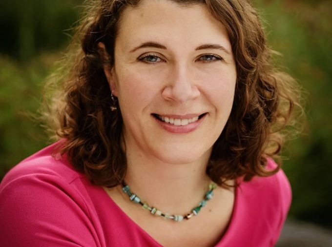 Headshot of Christina Grozinger, Ph.D., sitting outdoors.