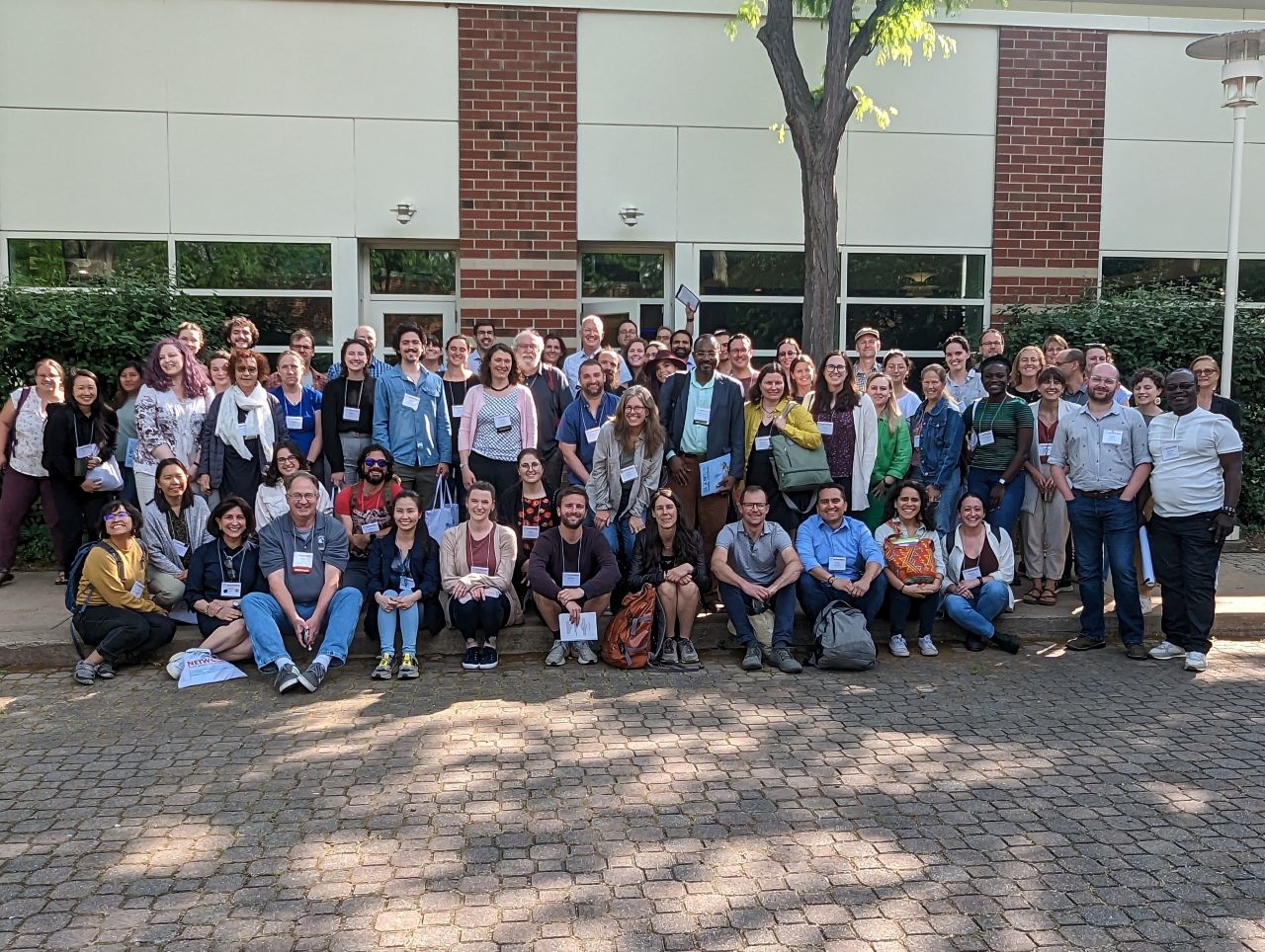 A large group of people pose for a group photo
